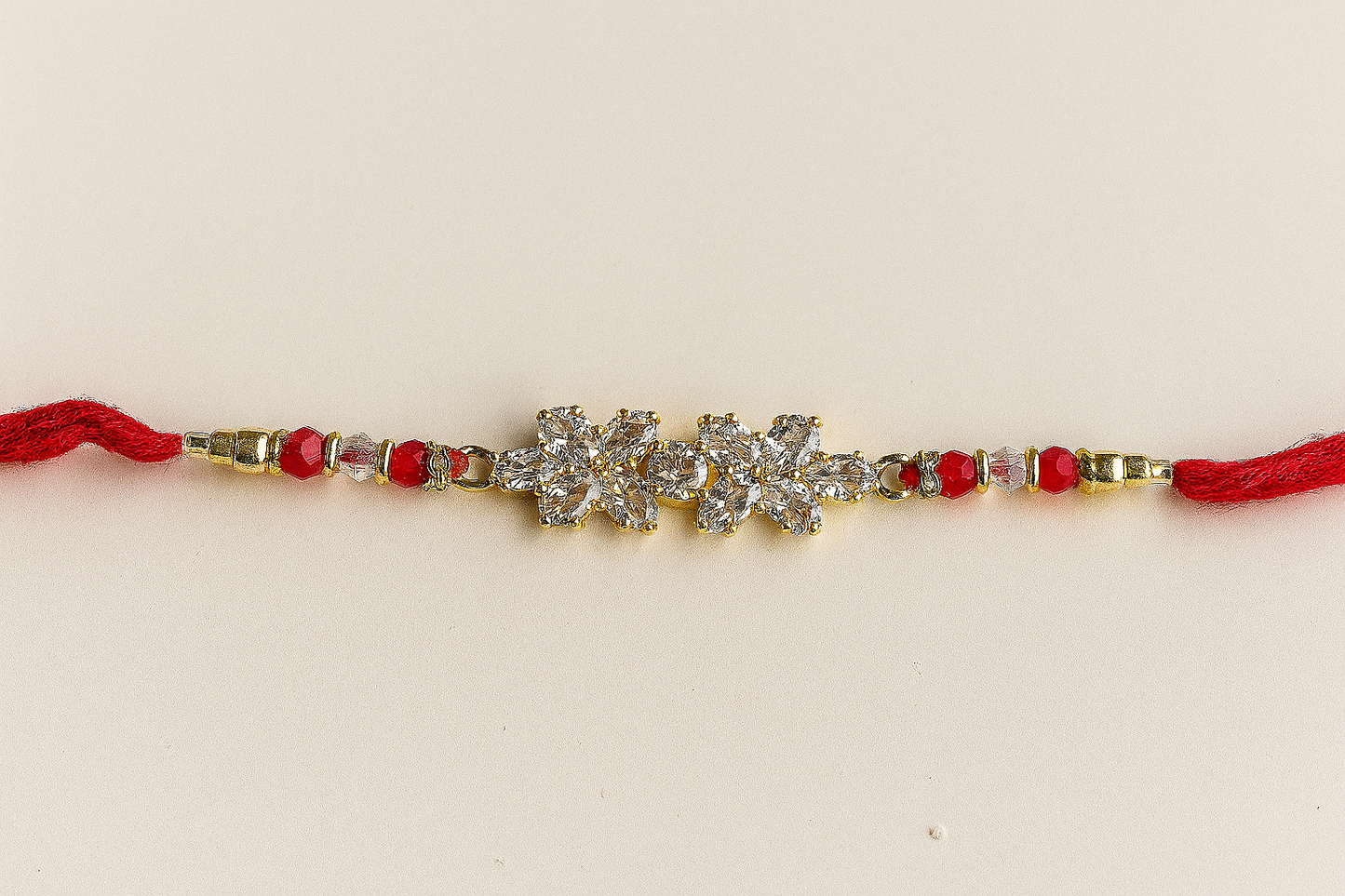 Elegant Twin Petal Rakhi with Zircon Stones